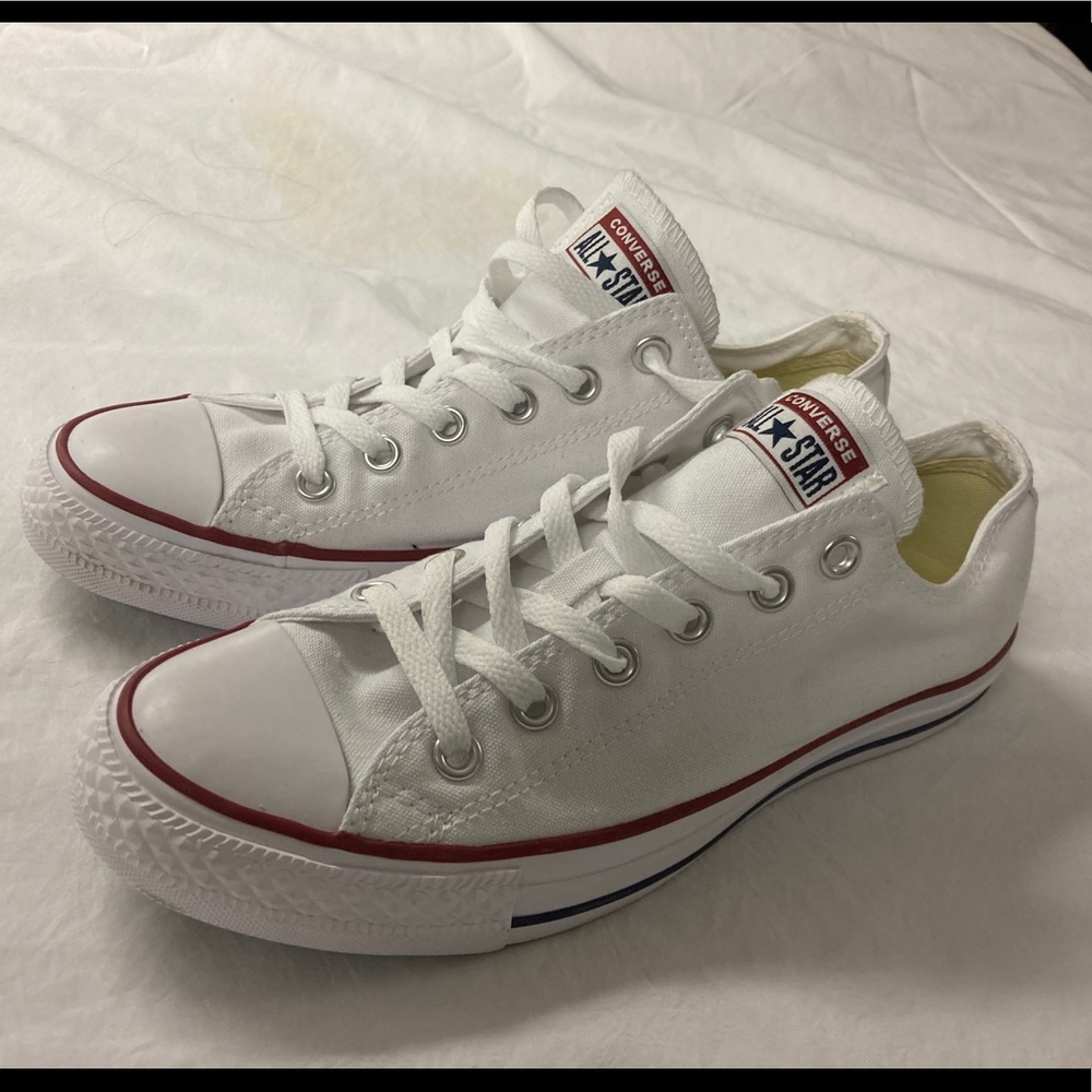 White Converse sneakers.